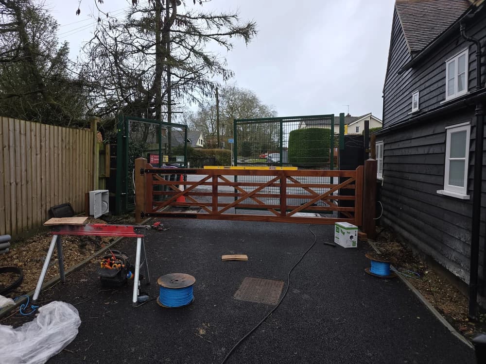 Timber five-bar field gate being installed